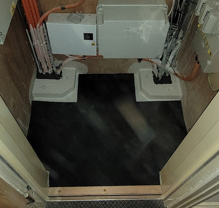 A picture showing electrical cupboard floor and passive fire protection to stop fire and smoking spreading.